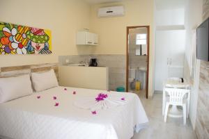 En eller flere senge i et værelse på Porto de Galinhas Yes Maria