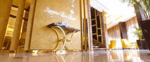 a lobby with a sign on the side of a wall at Lumiere Des Etoile in Kuwait