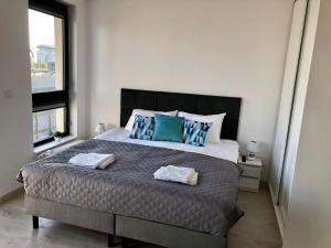 Posteľ alebo postele v izbe v ubytovaní Living Point Residence