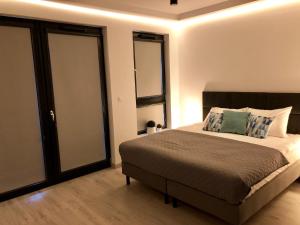 Posteľ alebo postele v izbe v ubytovaní Living Point Residence