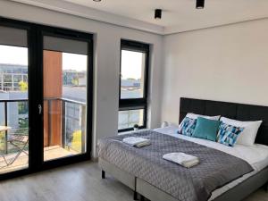 Posteľ alebo postele v izbe v ubytovaní Living Point Residence