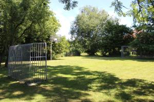 a cage in a park with a basketball hoop at OSTSEEferien am BARFUSSpark in Hasselberg