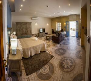 Postel nebo postele na pokoji v ubytování Casa Azzopardi Suites