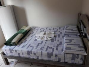 Cama o camas de una habitación en Hospedagem do Mineiro