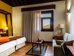 A bed or beds in a room at La Casona del Patio