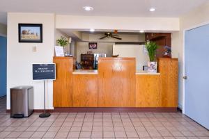 a restaurant with a counter in a room at Americas Best Value Inn Sullivan in Sullivan