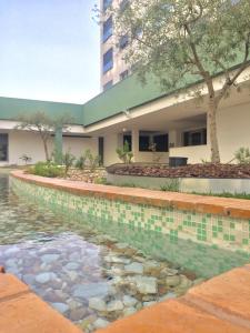 a swimming pool in front of a building at Apartment with Private Terrace & Car Garage in Lisbon