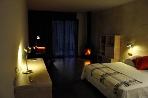 Postel nebo postele na pokoji v ubytování Hotel Fundació L'Olivar