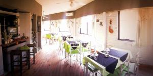 a restaurant with tables and chairs in a room at Noria Hotel in Villa Carlos Paz