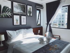 Voodi või voodid majutusasutuse Dang's Hotel toas