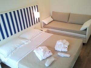 A bed or beds in a room at Mini Hotel