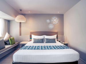Postel nebo postele na pokoji v ubytování Mercure Koh Chang Hideaway