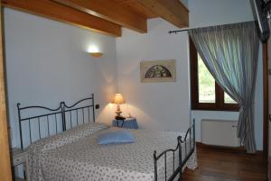 Katil atau katil-katil dalam bilik di Agriturismo Corte Morandini