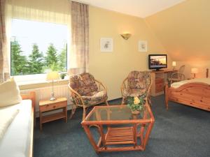 A seating area at Hotel Maromme