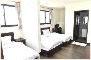 Postel nebo postele na pokoji v ubytování Lian-Yuan Homestay No. 1