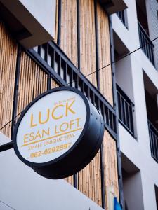 a sign for a ligil exam lot on a building at Luck Esan Loft in Ubon Ratchathani