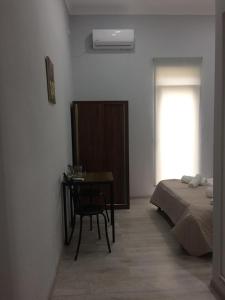 Postel nebo postele na pokoji v ubytování Kvara's House