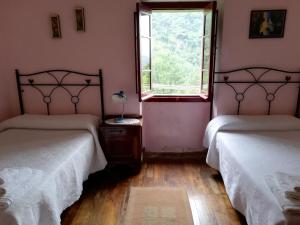 Ένα ή περισσότερα κρεβάτια σε δωμάτιο στο Casa Rural La Llerona