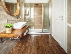 a bathroom with a sink and a shower at Bluemoon Sardinia in Cagliari