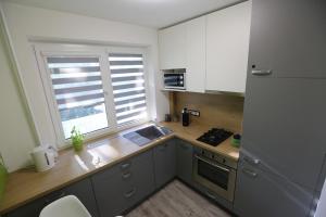 Η κουζίνα ή μικρή κουζίνα στο Modern & Homely Apartment - FREE PARKING - NETFLIX