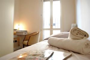 Posteľ alebo postele v izbe v ubytovaní Dreaming Piazza Bra Rooms