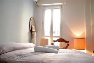 Posteľ alebo postele v izbe v ubytovaní Dreaming Piazza Bra Rooms