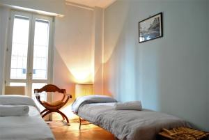 Posteľ alebo postele v izbe v ubytovaní Dreaming Piazza Bra Rooms