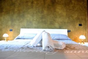 Posteľ alebo postele v izbe v ubytovaní Dreaming Piazza Bra Rooms