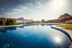 Bazén v ubytování Gran Hotel Ciudad Del Sur nebo v jeho okolí