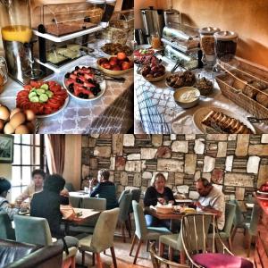 un grupo de personas sentadas en una mesa con comida en Hotel Kastri, en Loutra Edipsou