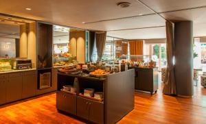 a kitchen with a counter with food on it at chic&basic VELVET in Barcelona +32 photos