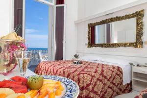 Postel nebo postele na pokoji v ubytování Hotel Lido