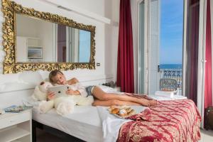Postel nebo postele na pokoji v ubytování Hotel Lido