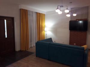 Televízia a/alebo spoločenská miestnosť v ubytovaní Apartament Centrum + 2 fotografie