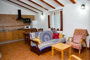 a living room with a couch and a table at Casas Rurales Mirador del Mundo in Yeste
