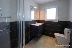 a bathroom with a toilet and a sink and a shower at LV02 in Empuriabrava
