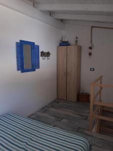 Posteľ alebo postele v izbe v ubytovaní Casetta Dei Pescatori