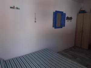 Posteľ alebo postele v izbe v ubytovaní Casetta Dei Pescatori