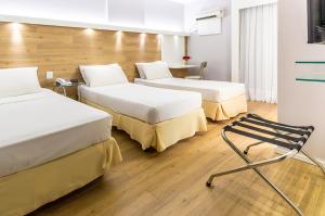 Postel nebo postele na pokoji v ubytování Hotel Costamar Ponta Verde