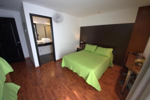Postel nebo postele na pokoji v ubytování Sur Hotel