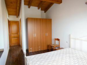 A bed or beds in a room at Residenza Il Pappagallo