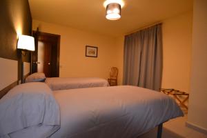 Postel nebo postele na pokoji v ubytování Apartamentos Turisticos Poblado