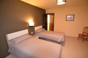 Postel nebo postele na pokoji v ubytování Apartamentos Turisticos Poblado
