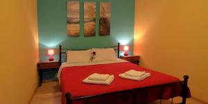A bed or beds in a room at Ionia rooms