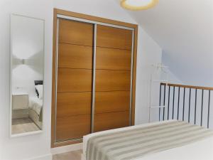 A bed or beds in a room at Loft Duplex Malaga