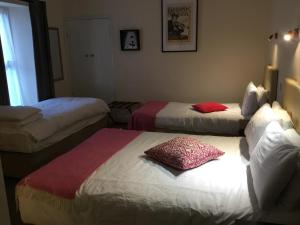 Postel nebo postele na pokoji v ubytování Rolling Wave Guesthouse