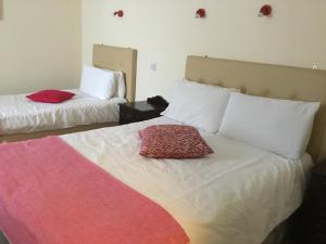 Postel nebo postele na pokoji v ubytování Rolling Wave Guesthouse