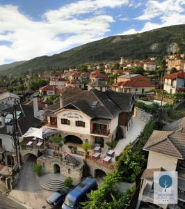 an aerial view of a town with a mountain at Grand Hotel Dentro in Konitsa