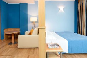 Postel nebo postele na pokoji v ubytování Garda Hotel