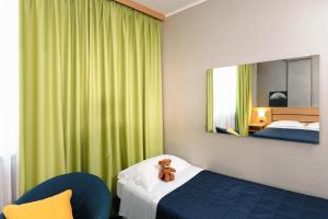 Postel nebo postele na pokoji v ubytování Garda Hotel